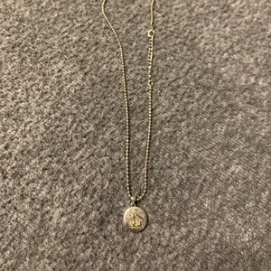 Silver necklace with round “L” pendant